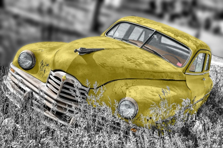 an old yellow car is parked in a field, a colorized photo, by Arnie Swekel, trending on pixabay, photorealism, monochrome, bling, photorealism. trending on flickr, scrapyard