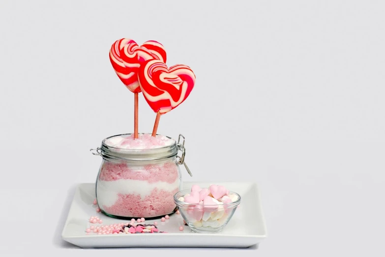 a couple of heart shaped lollipops in a jar, inspired by Peter Alexander Hay, textured base ; product photos, sugar snow, productphoto, cupcake