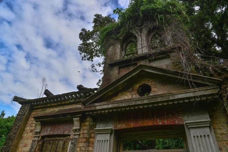 a tall tower with a clock on top of it, by Edward Corbett, pixabay, art nouveau, abandoned overgrown graveyard, calcutta, roof with vegetation, taken with sony alpha 9