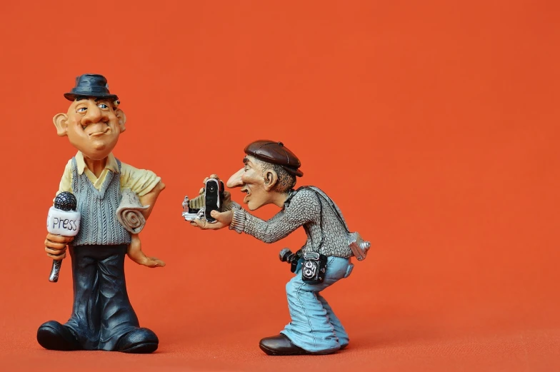 a couple of figurines standing next to each other, a picture, pixabay contest winner, photorealism, don ramon, taking a picture, caricaturist, people at work