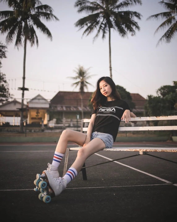 a woman sitting on top of a wooden bench, a picture, inspired by Rudy Siswanto, shutterstock, realism, roller skating, wearing shorts and t shirt, 7 0 mm photo, fashion portrait photo