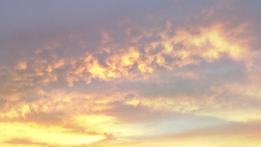 there is a plane that is flying in the sky, by Linda Sutton, flickr, romanticism, violet and yellow sunset, banner, detailed clouds, loosely cropped