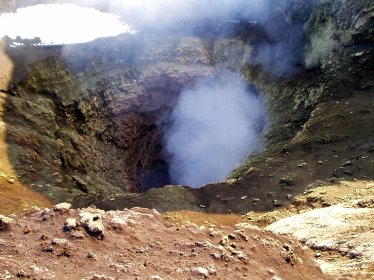 a crater with smoke coming out of it, flickr, brimstone, taken in the mid 2000s, interior, head