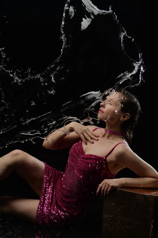 a woman in a pink dress blowing water on her face, art photography, dynamic dance photography, wet swimsuit, glitter, production still