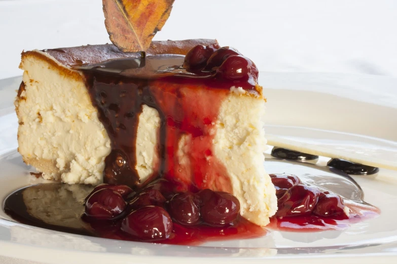 a piece of cake sitting on top of a white plate, inspired by François Louis Thomas Francia, romanticism, cherries, maple syrup & hot fudge, closeup - view, flan