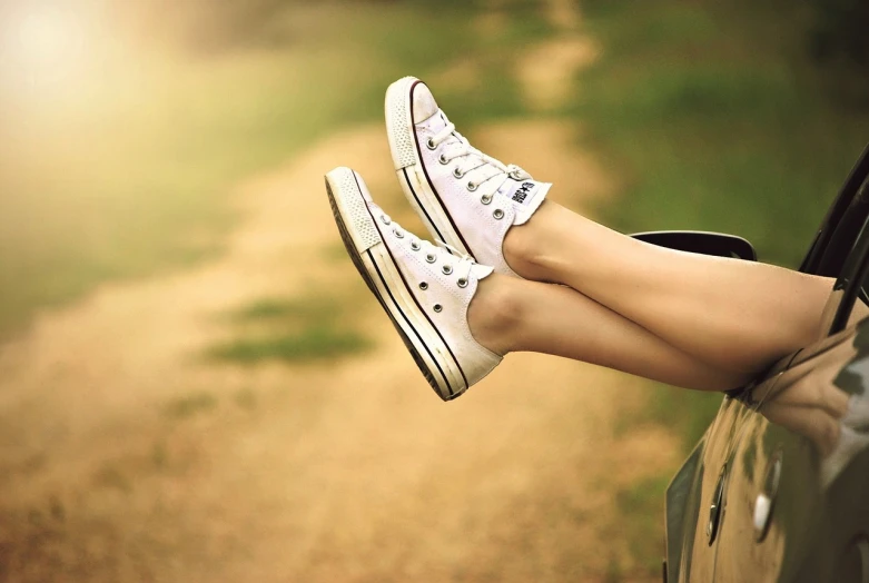 a woman's legs sticking out of a car window, a picture, trending on pixabay, realism, wearing white sneakers, converse, low sun, beautiful iphone wallpaper