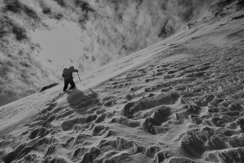 a man riding skis down a snow covered slope, a black and white photo, by Cedric Peyravernay, featured on pixabay, figuration libre, climbing mountain in washington, dune, ivan bolivian, highly textured