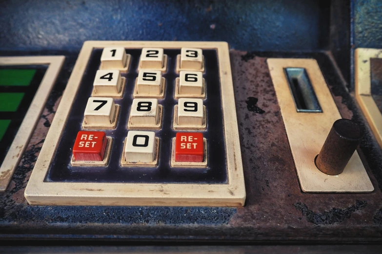 a close up of a calculator with numbers on it, a photo, flickr, les automatistes, broken vending machines, textured, red brown and blue color scheme, key still
