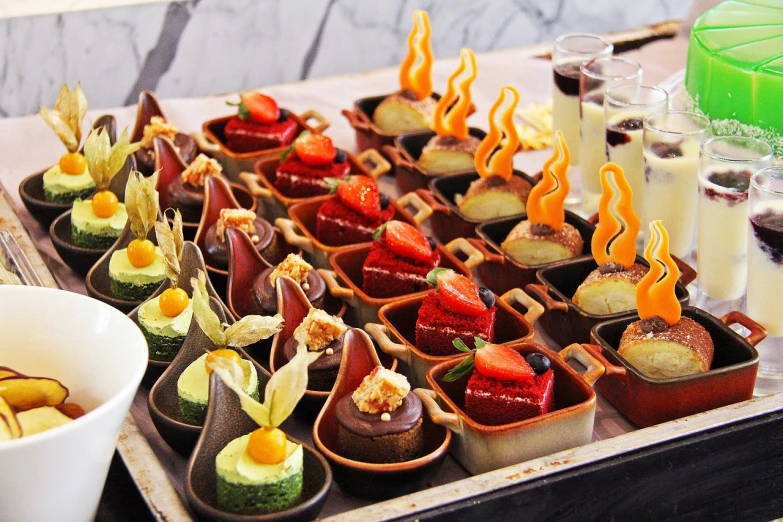 a close up of a tray of food on a table, inspired by Antonio Rotta, cakes, torches, sea of parfait, chocolate