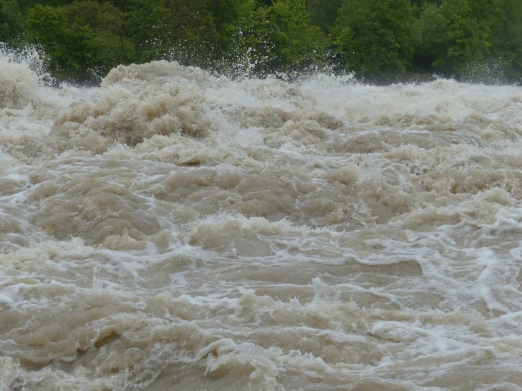 a man riding a wave on top of a surfboard, a picture, hurufiyya, flood, massive river, rain!!!!, georgic