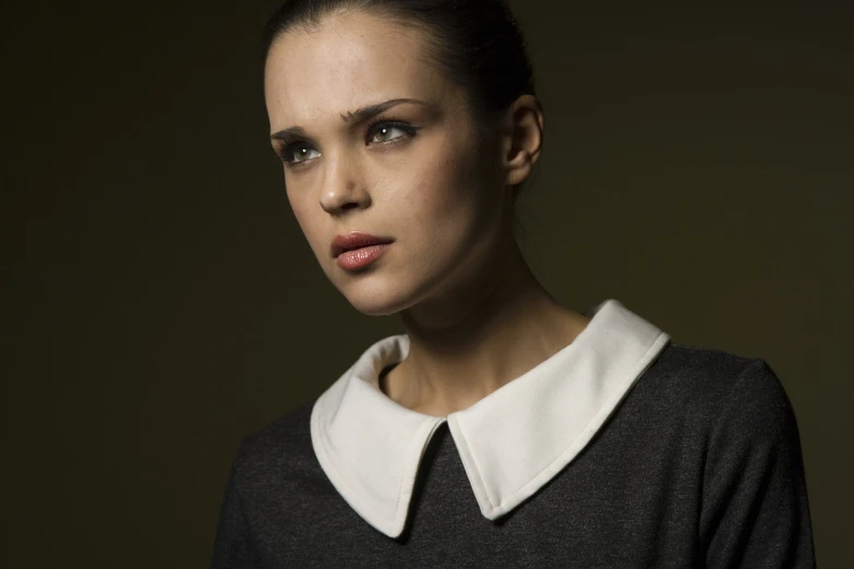 a woman in a black sweater with a white collar, by Etienne Delessert, flickr, dafne keen, artem chebokha, serious business, natali portman