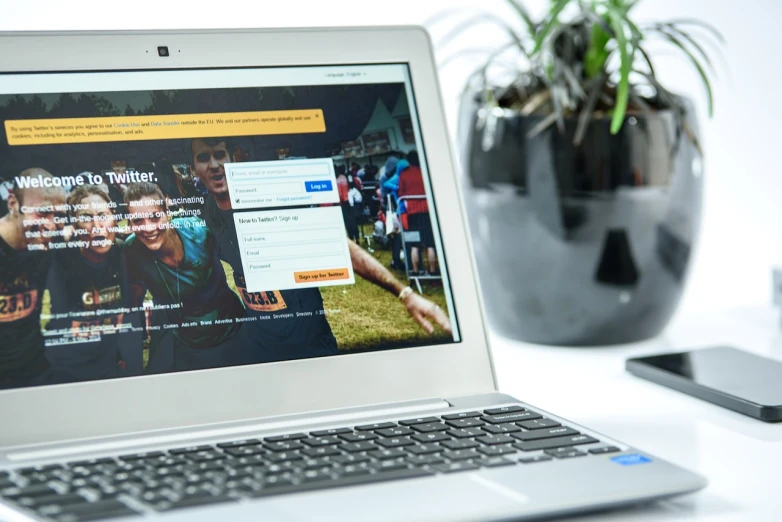 a laptop computer sitting on top of a white desk, a screenshot, by Matt Cavotta, featured on pexels, splash page, up close picture, register, 5 0 0 px