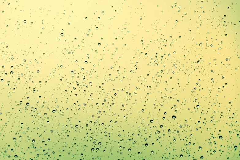 a close up of water droplets on a window, a picture, inspired by Elsa Bleda, minimalism, with a yellow green smog sky, no gradients, bubbly, hiperdetailed