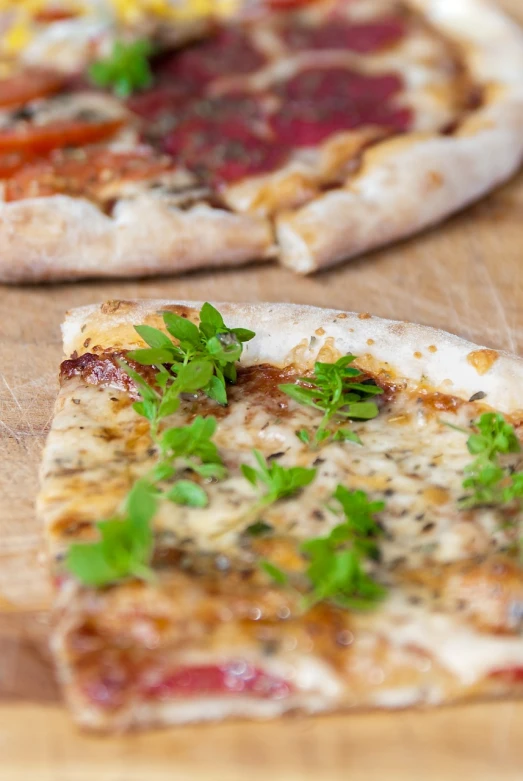 a couple of pizzas sitting on top of a wooden table, by Ella Guru, shutterstock, hurufiyya, side view close up of a gaunt, clover, portlet photo, detailed picture