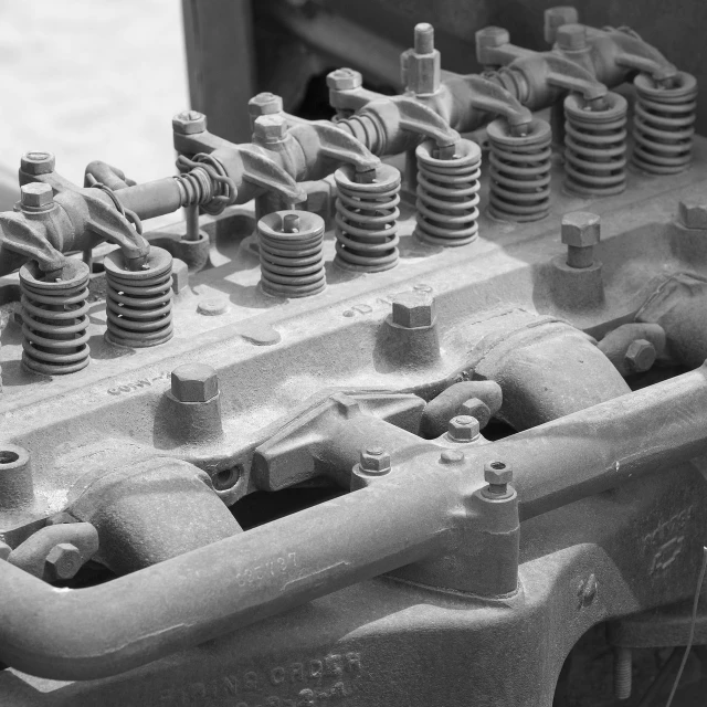 a black and white photo of an old engine, a portrait, fine art, pistons and bolts, intricate details photograph, springs, photography ultrafine detail