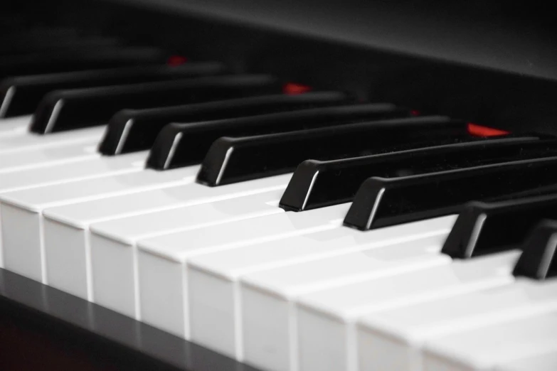 a close up of a black and white piano keyboard, closeup photo, modern very sharp photo