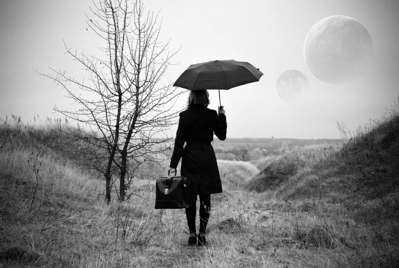 a black and white photo of a woman holding an umbrella, by Lucia Peka, unsplash, surrealism, multiple moons, walking to work with a briefcase, erik johansson, still life