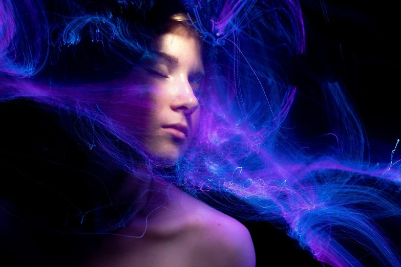 a close up of a person with long hair, by Antoni Pitxot, digital art, ultraviolet light, portrait of magical young girl, long exposure photo, wisps of energy in the air