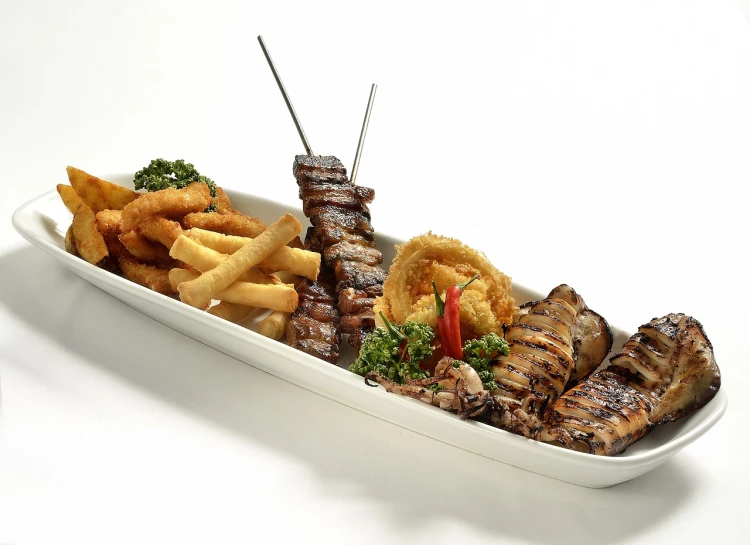 a close up of a plate of food on a table, dau-al-set, highly detailed product photo, grill, trio, with fries