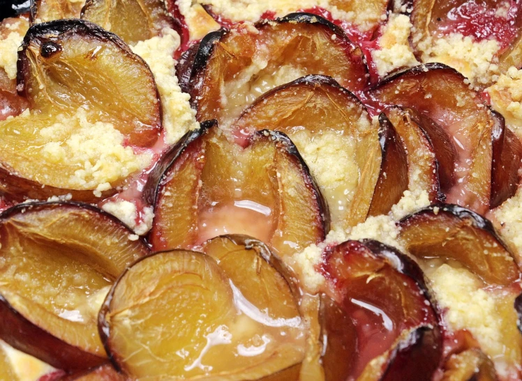 a close up of a plate of food with plums, molten, sand, filling the frame, feature