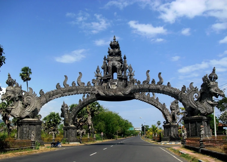 a group of statues on the side of a road, a picture, flickr, sumatraism, huge gate, jormungandr, perfect design, massive arch