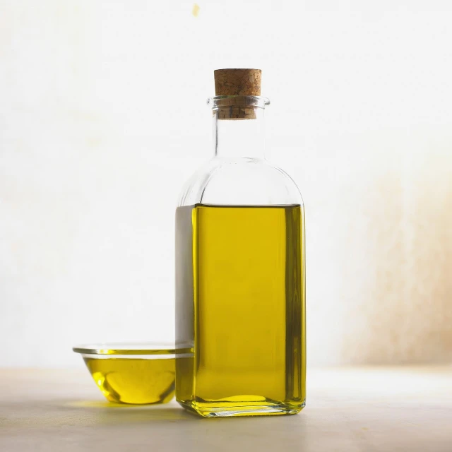 a bottle of olive oil next to a bowl of olive oil, a picture, difraction from back light, soft natural lighting, stacked image, danbooru