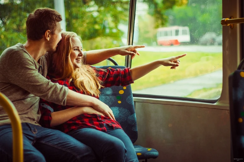 a man and a woman sitting on a bus, a picture, shutterstock, romanticism, happy girl, touching, 1 1 1 1, plan