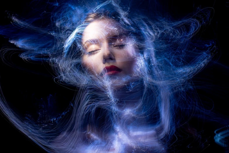 a woman with her eyes closed and her hair blowing in the wind, by Eugeniusz Zak, pexels, digital art, diffuse lightpainting, with blue light inside, portrait!!!, floating in perfume
