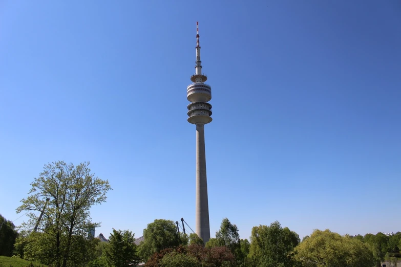 a tall tower sitting in the middle of a park, a picture, shutterstock, bauhaus, antennas, nuremberg, fully body photo, vienna city