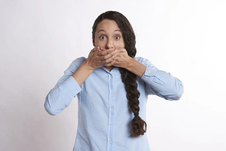 a woman covering her mouth with her hands, a picture, shutterstock, antipodeans, comedian is funny, got shut down, cheeky!!!, giant mouth