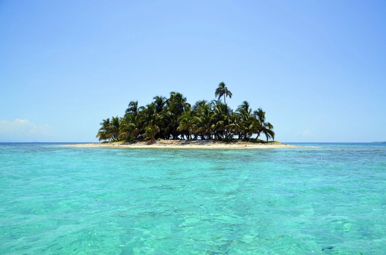 a small island in the middle of the ocean, a photo, with palm trees in the back, usa-sep 20, colombian, very sharp photo