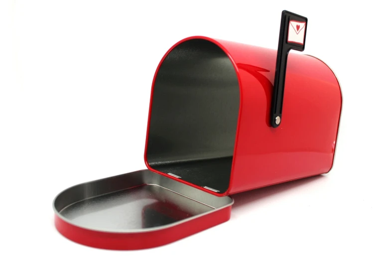 a red mailbox sitting on top of a white surface, metal lid, photograph credit: ap, red - black, opening