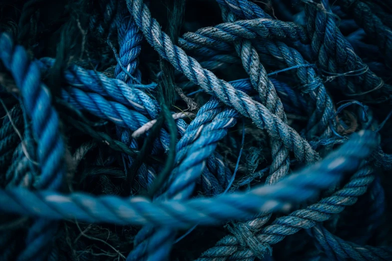 a pile of blue rope laying on top of each other, a macro photograph, by Jacob Kainen, trending on pexels, plasticien, mobile wallpaper, badass composition, drifting, hanging
