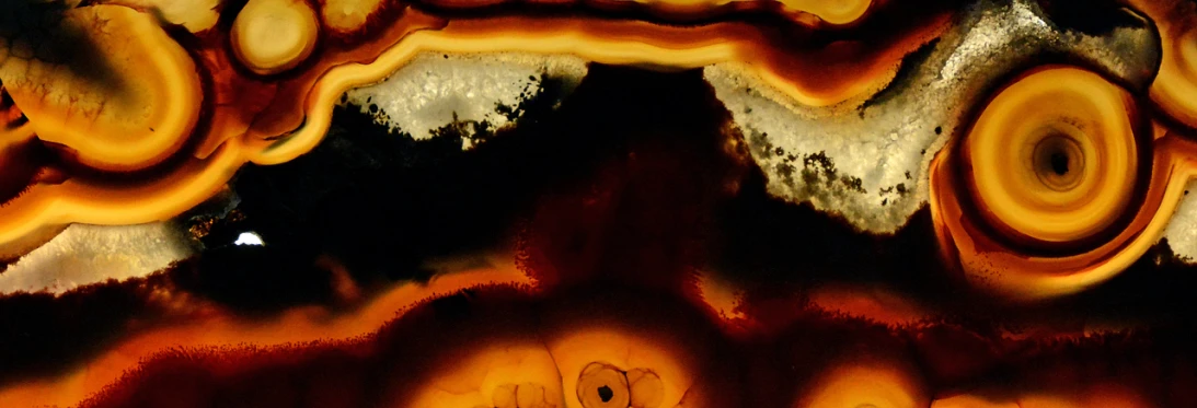 a close up of a large piece of art, a microscopic photo, by Jan Rustem, baroque, onyx, amber glow, paleolithic cave art, overhead view