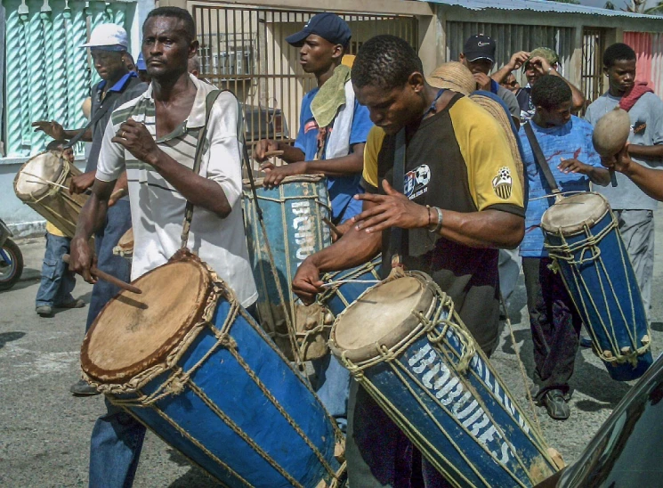 a group of men playing drums on a street, flickr, boroque, mongezi ncaphayi, medium detail, afp