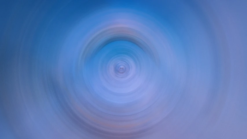 a blurry photo of a circular object in the sky, by Jan Rustem, unsplash, abstract illusionism, blue rays from tv, porcelain, whorl, the nonlinear. digital painting