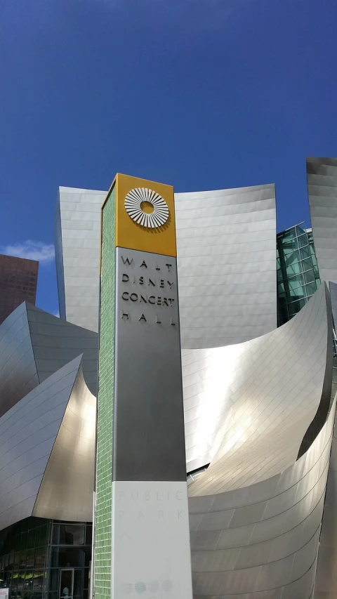 a tall building with a clock on top of it, a photo, cg society contest winner, paul laffoley, !dream los angeles, concert hall, claes oldenburg