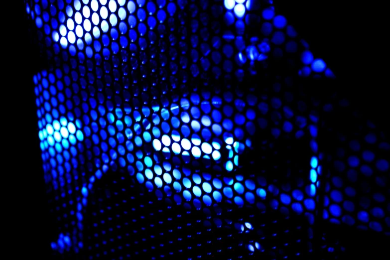 a close up of a cell phone screen with blue lights, a macro photograph, by Jon Coffelt, flickr, perforated metal, nightclub background, abstract holescape, modern high sharpness photo