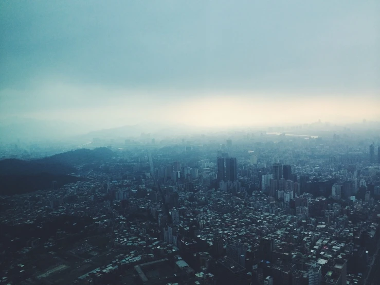 a view of a city from the top of a building, happening, foggy weather atmosphere, taiwan, helicopter view, dreamy hazy