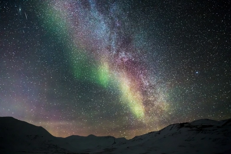 the milky shines brightly in the night sky, a portrait, by Jørgen Nash, breathtaking colors, heaven in the top, distant mountains lights photo