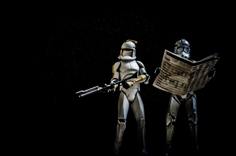 a couple of action figures standing next to each other, flickr, holography, reading the newspaper, hd star wars photo, studio lit, war theme