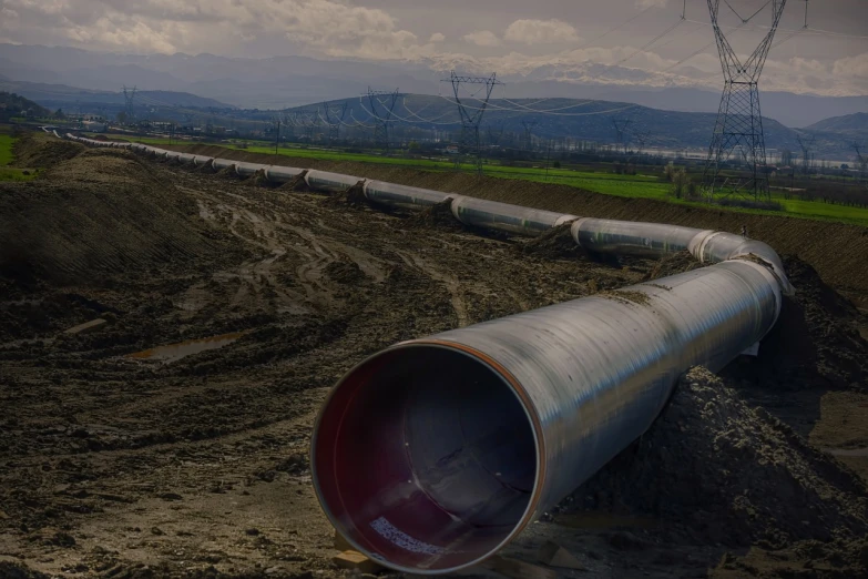 a large pipe laying on top of a dirt field, a portrait, by Arthur Sarkissian, shutterstock, oil lines, high quality product image”, landscape wide shot, tube wave