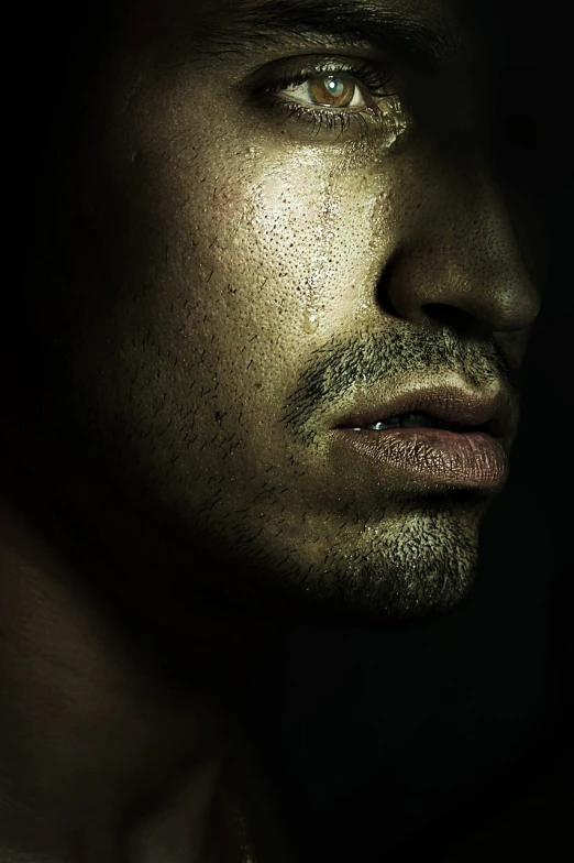 a close up of a man's face in the dark, hyperrealism, with tears, face profile, super realistic photo, lean man with light tan skin