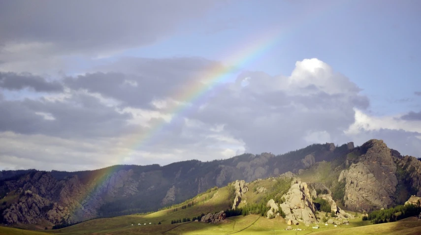 there is a rainbow in the sky over the mountains, by Muggur, romanticism, photo of genghis khan, ap photo, svetlana belyaeva, precious gems