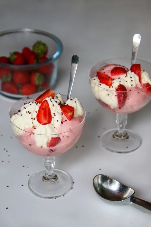 a couple of desserts sitting on top of a table, inspired by Valentine Hugo, strawberry ice cream, luscious with sesame seeds, serving suggestion, sheer