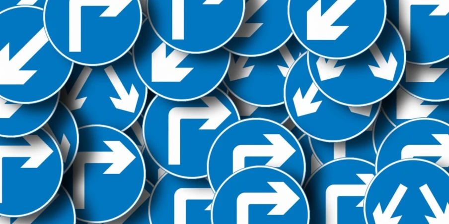 a lot of blue and white signs with arrows, by Matija Jama, trending on pixabay, digital art, round, unobstructed road, vertical orientation, left - hand drive