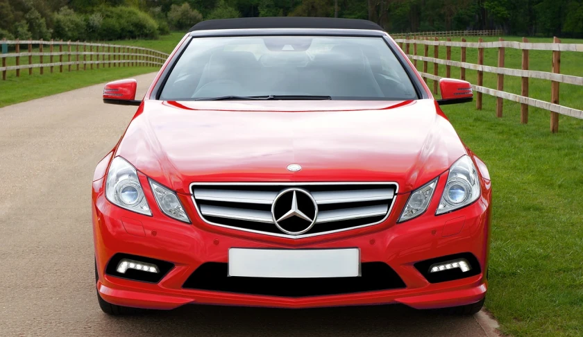 a red car parked on the side of a road, by Julian Allen, trending on pixabay, renaissance, mercedez benz, front face, commercial banner, 2 0 1 2