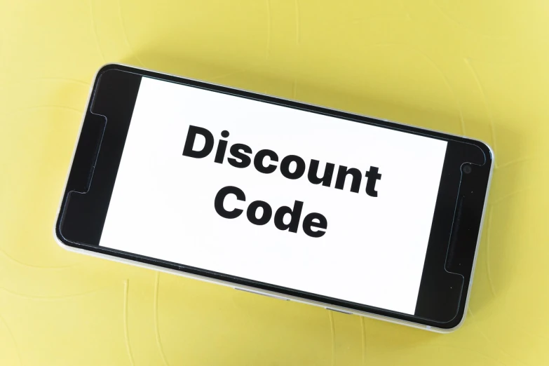 a cell phone sitting on top of a yellow surface, a stock photo, beautiful code, limited time offer, coat, coding