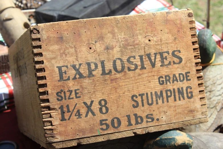 a wooden crate sitting on top of a pile of junk, by David Simpson, flickr, uses explosives, stamped, eruption, huge!!!