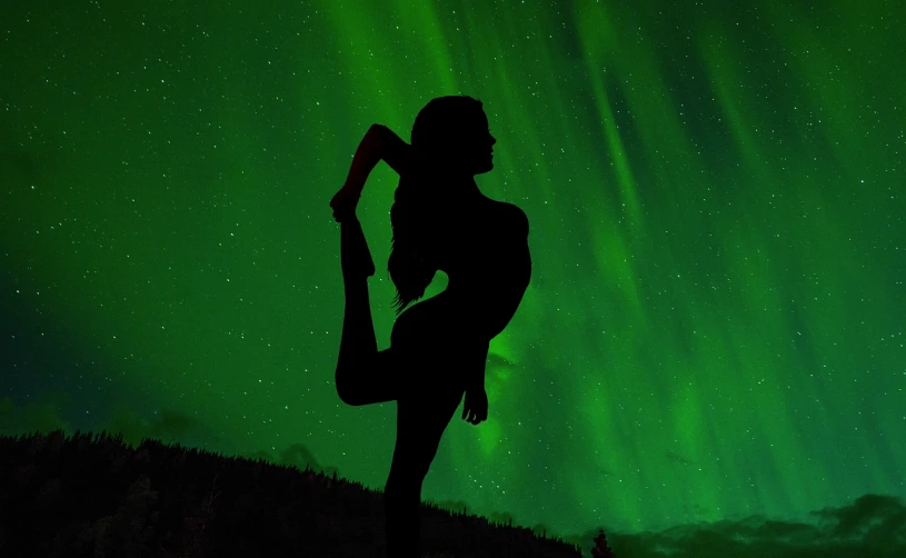 a silhouette of a person doing a yoga pose, a picture, aurora, lascivious pose, outdoor photo